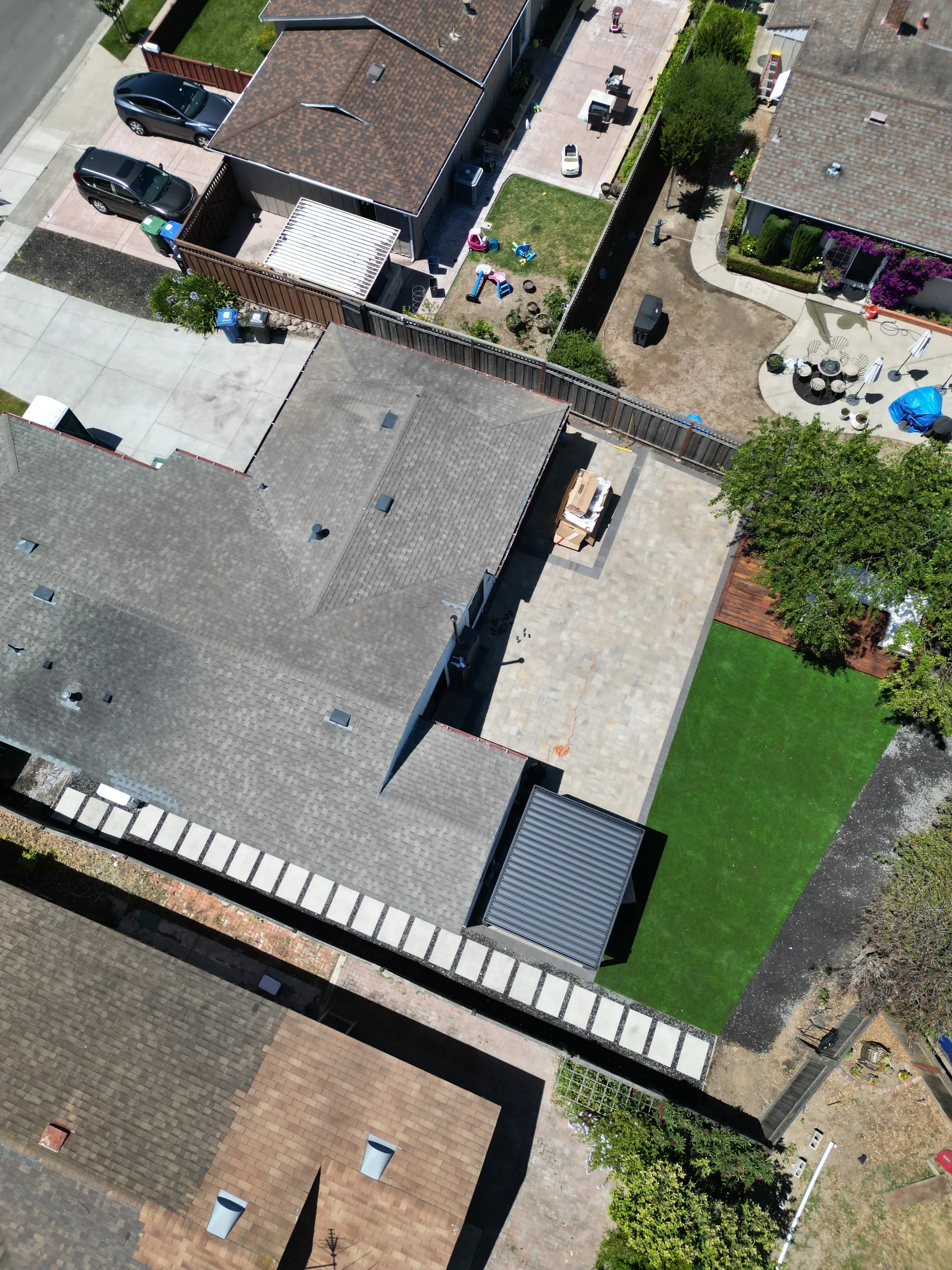 Wide aerial establishing shot of paver patio installation and backyard in Fairfield, CA